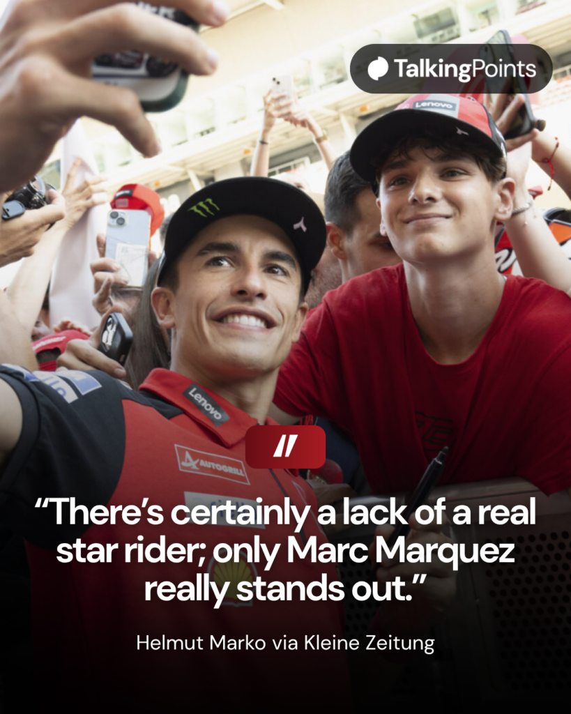 Marc Marquez taking a selfie with a fan at the 2025 Catalan Grand Prix.