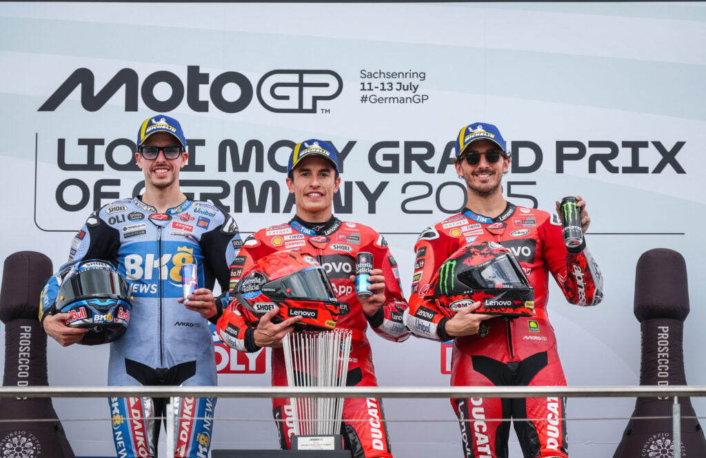 Marc Marquez and Francesco Bagnaia of Ducati on the 2025 German Grand Prix podium with Alex Marquez of Gresini