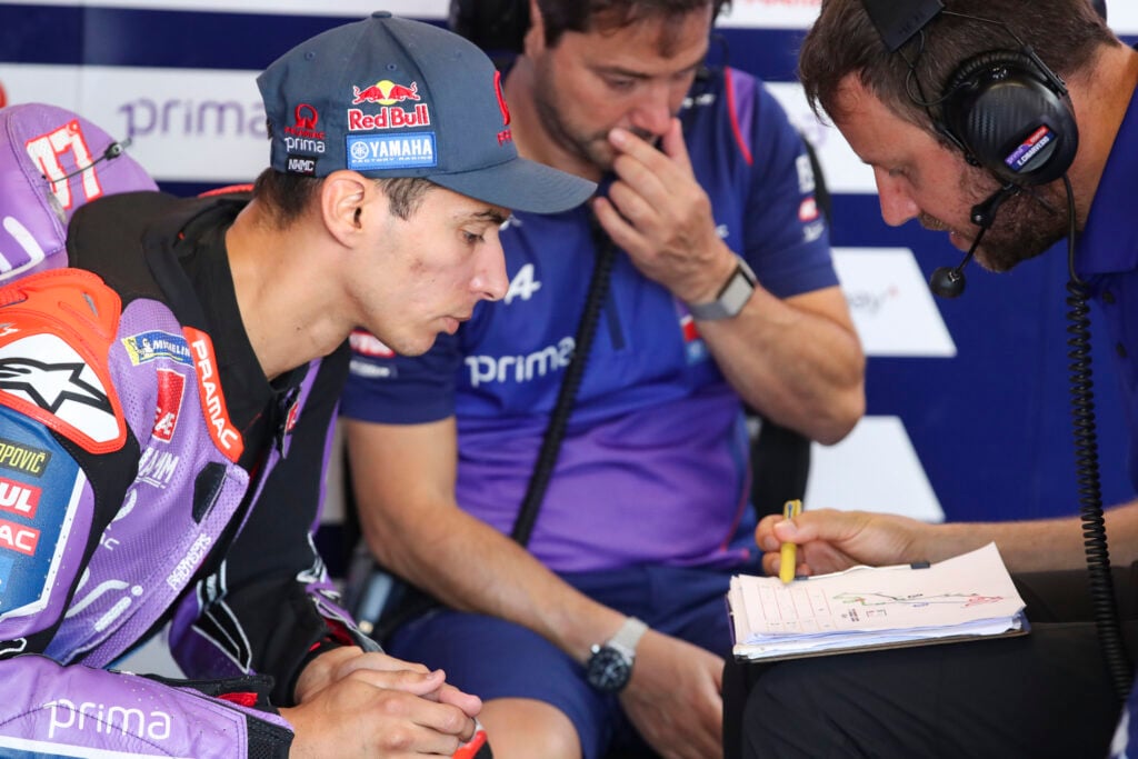 Pramac Yamaha rider Toprak Razgatlioglu talks to his engineer in the garage before the 2026 MotoGP Dutch Grand Prix